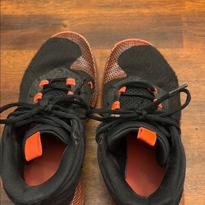 Under Armour Black and Orange Athletic Shoes with Mesh Upper
